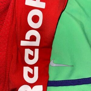 THREE PAIR!!! 2 Reebok XL Running shorts and one pair of Nike XL running shorts.